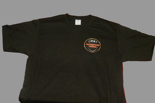 Black t-shirt with a logo on the chest against a gray background