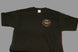 Black t-shirt with a logo on the chest against a gray background